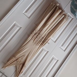 Beautiful champagne colored gown with spaghetti straps, fit & flair style